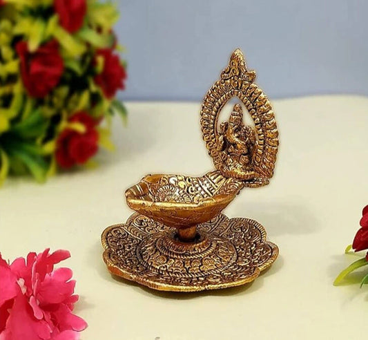 Ganesh Hand Hold Diya in brass with gold finish, decorative pooja diya for home and festive decor