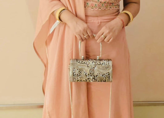 Elegance Redefined: A Happy Customer with Our Intricate Carving Silver Purse