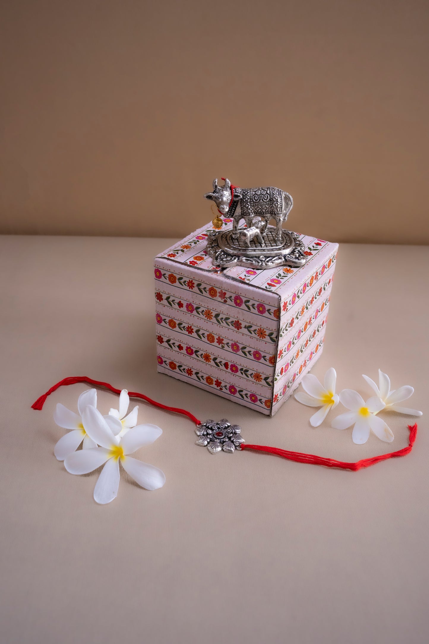 Kamdhenu Idol with calf with rakhi