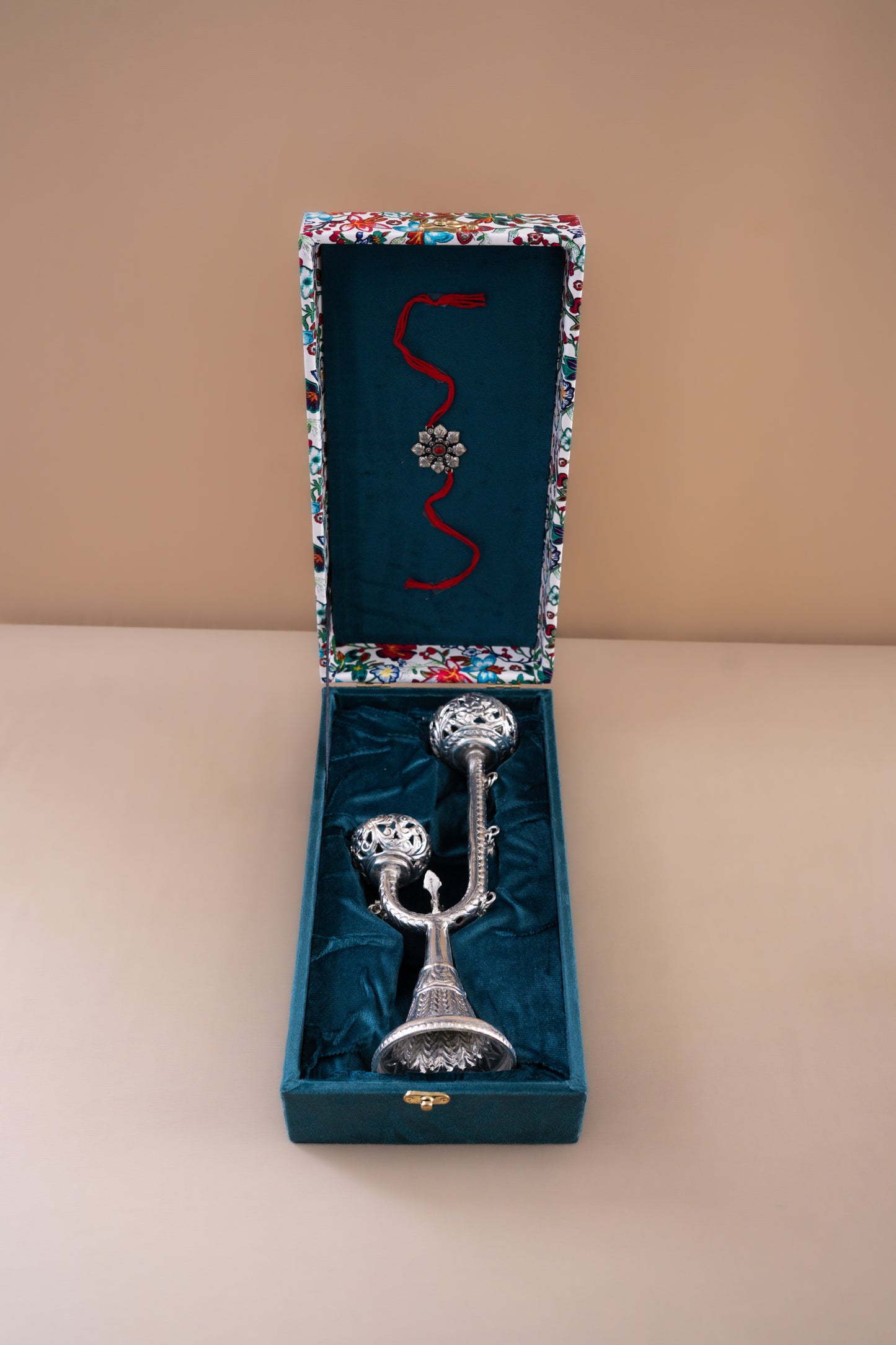 Silver plated candle holder with decorative bells