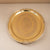 Gold decorative tray on a beige background