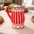 Red and white striped pitcher on a table with a neutral background