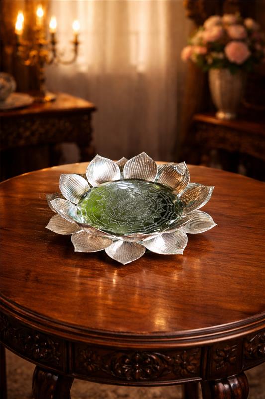 Decorative glass bowl on a wooden table with a warm, blurred background
