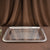 Silver tray on a brown fabric background