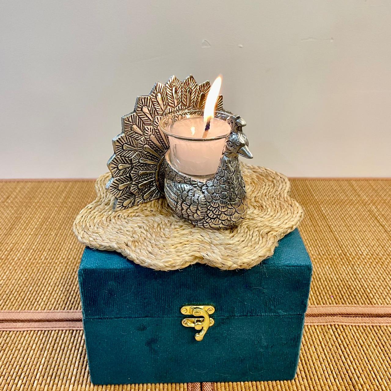 candle holder with a peacock design