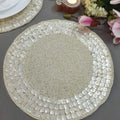 Round woven placemat on a gray surface with decorative elements.
