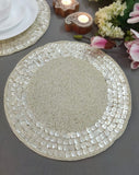 Round woven placemat on a gray surface with decorative elements.