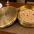 Decorative brass box with tortillas on a wooden table