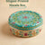 Decorative masala box with floral patterns on a beige background
