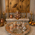 Decorative altar and ornate metal tray.