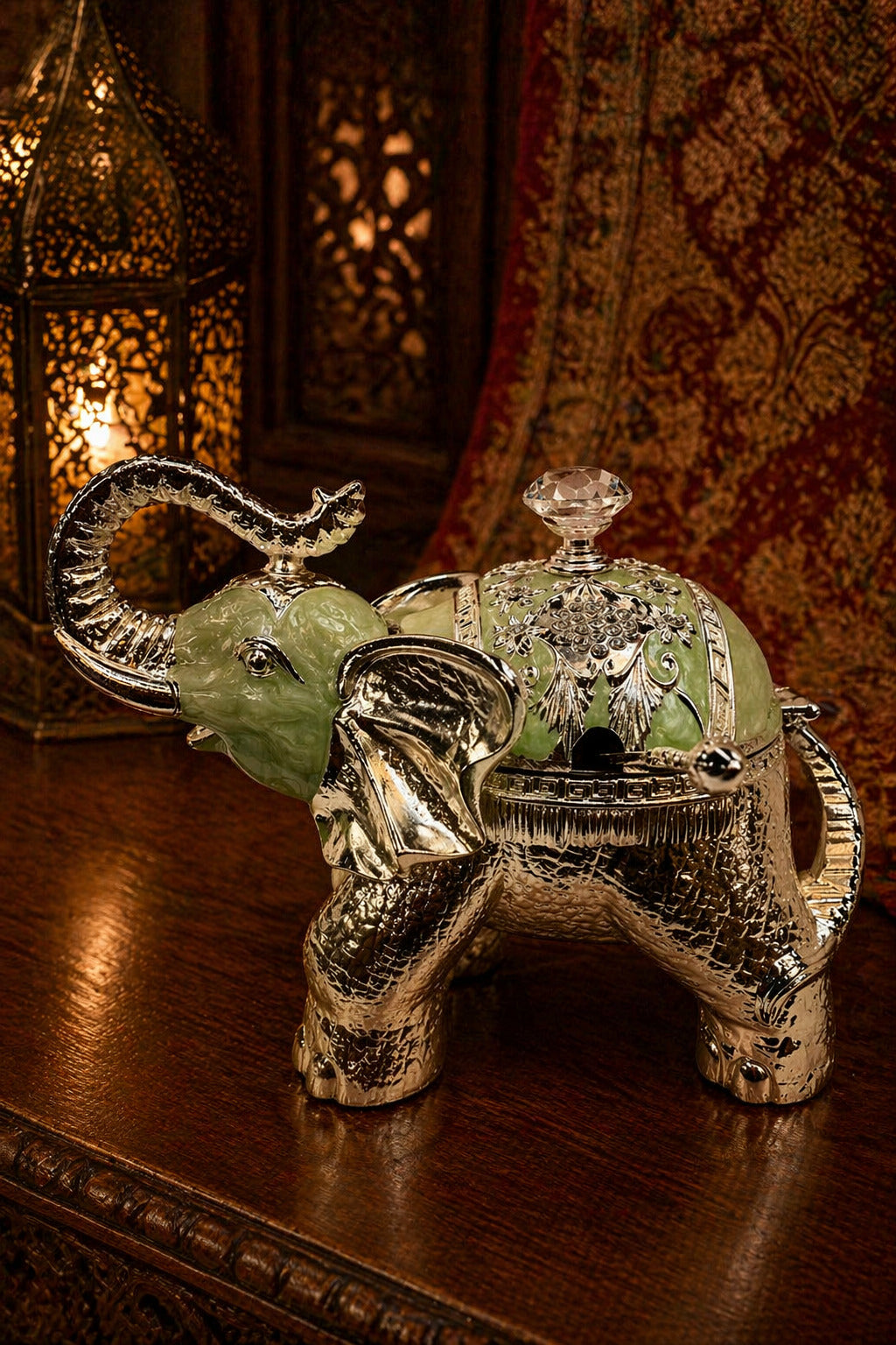 Decorative elephant with crystal ball on a wooden surface