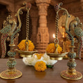 Decorative oil lamps with flowers on a table in an ornate setting